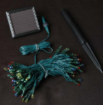 Multi Colored LED Solar Powered Lights 100 Light String Green Wire