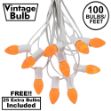 100 C7 String Light Set with Orange Ceramic Bulbs on White Wire
