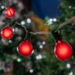 25 G40 Globe String Light Set with Red SatinBulbs on Green Wire