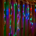 Rainbow LED Icicle Lights on White Wire 70 Bulbs