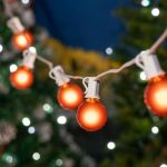 100 G40 Globe String Light Set with Orange Satin Bulbs on White Wire