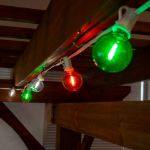 25 LED Filament G40 Globe String Light Set with Transparent Orange, Green & White Bulbs on White Wire